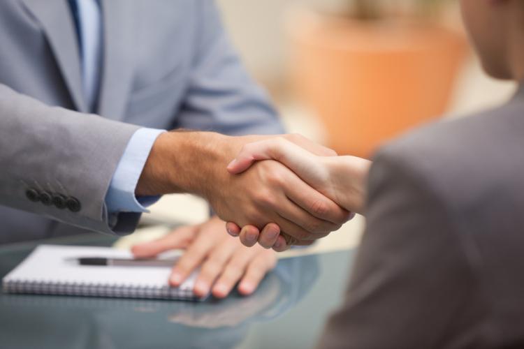 Two person shaking hands doing business