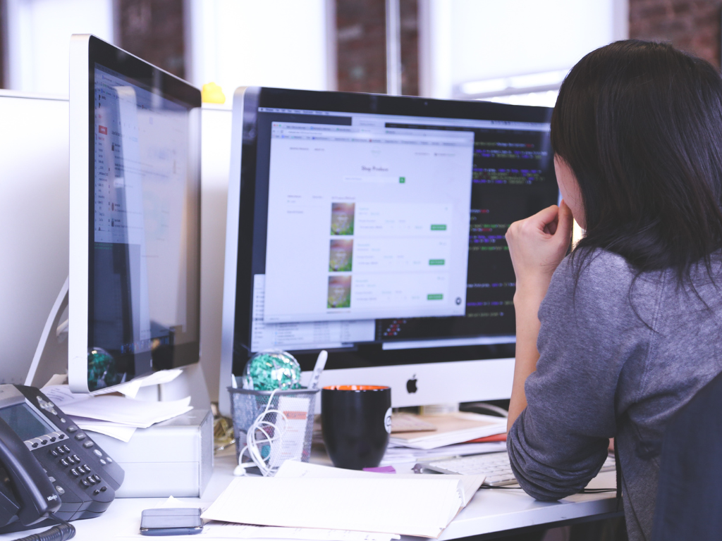 Woman looking at SaaS business listings for sale