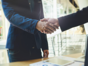 Two business man shaking hands