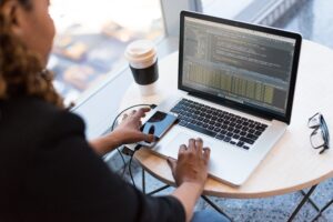 Software developer coding at desk