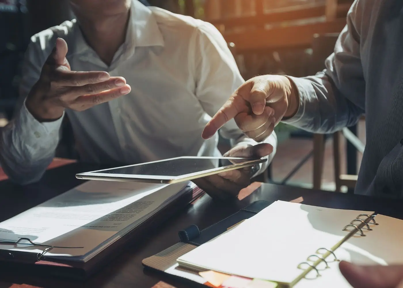 Business owners closing a deal and finalizing company sale