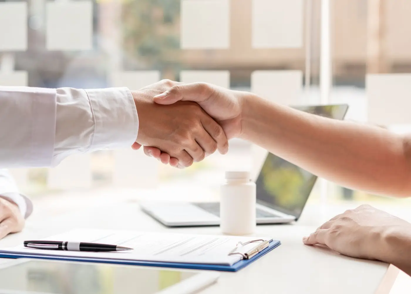 Handshake symbolizing a successful business sale and closing deal